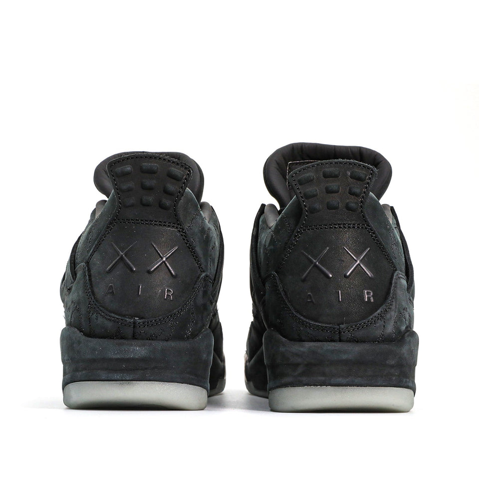 Nike KAWS x Air Jordan 4 Retro 'Black' Black/Black-Clear Glow 930155-001 01